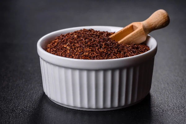 Rooibos tea on a black background