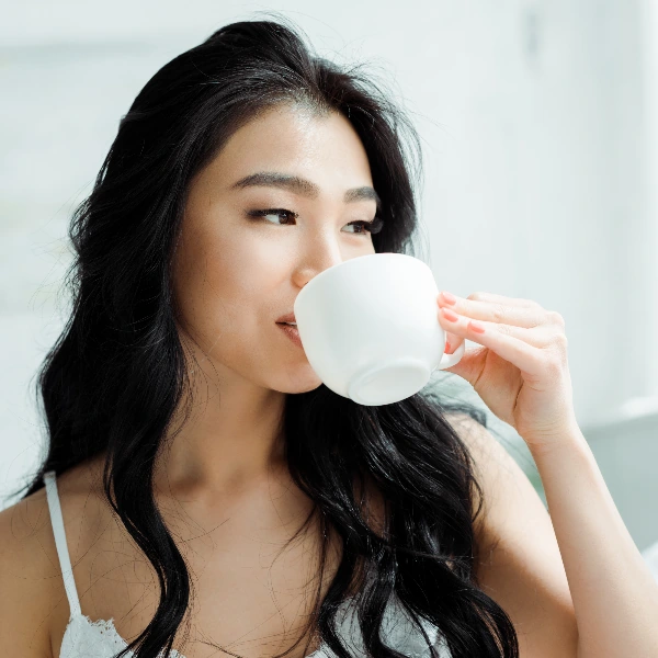 woman drinking white tea